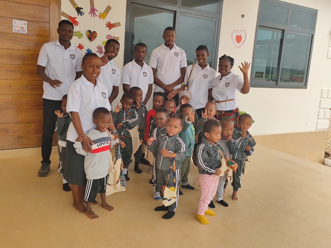 Students with their teacher on the playground